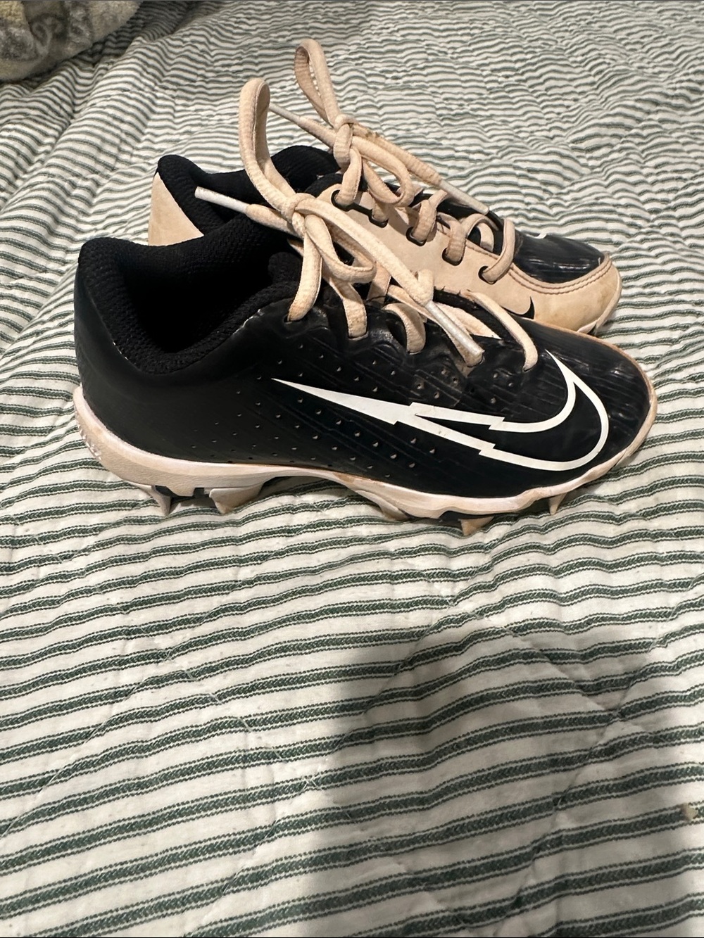 Nike Black and Beige Youth Baseball Cleats with White Swoosh